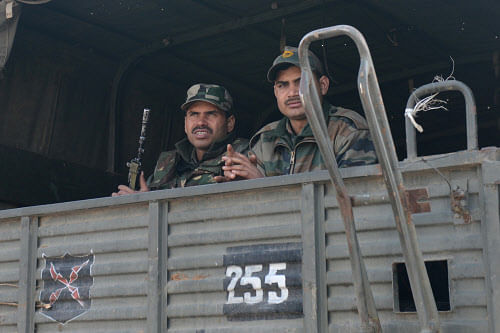 Original     Indian soldiers ride in a military truck as they move towards a camp in Jammu on January 10, 2013. The beheading of an Indian soldier may have sparked a war of words between Delhi and Islamabad but the two nuclear rivals are both determined to prevent it from wrecking a fragile peace process.