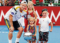 family affair: Australias Lleyton Hewitt with his children Mia, Ava (in front) and Cruz after winning the Kooyong     Classic in Melbourne on Saturday. Hewitt defeated Juan Martin del Potro in the final. AFP
