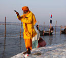 A Sadhu, or Hindu holy man, prays after taking a dip at the Sangam, the confluence of rivers Ganges, Yamuna and mythical Saraswati, in Allahabad, india, Friday, Jan. 11, 2013. Millions of Hindu pilgrims are expected to take part in the large religious congregation of a period of over a month on the banks of Sangam during the Maha Kumbh festival in January 2013, which falls every 12th year.