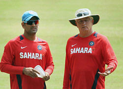 Indian cricket team captain M S Dhoni with coach Duncan Fletcher during a practice session in Kochi on Monday. PTI Photo