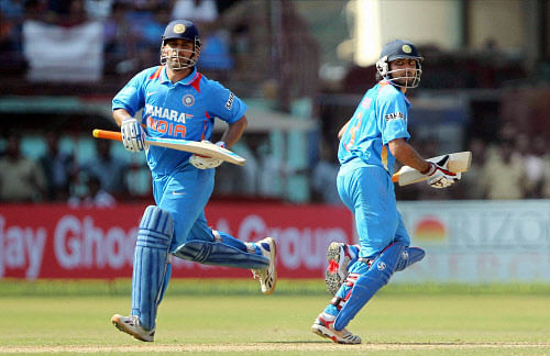 Indias MS Dhoni and Ravindra Jadeja run between the wickets during the 2nd ODI match against England in Kochi on Tuesday. PTI
