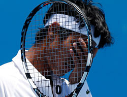 India's Somdev Devvarman reacts during his second round loss to Poland's Jerzy Janowicz at the Australian Open tennis championship in Melbourne, Australia, Wednesday, Jan. 16, 2013. (AP Photo/Andy Wong)