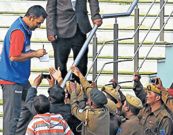 in demand Policemen gather around to get local lad and India skipper Mahendra Singh Dhonis autograph at the Jharkhand State Cricket Association stadium in Ranchi. PTI