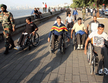 Army jawans, injured in various army operations, participating for the Mumbai Marathon Dream run Wheelchair event at Marine Drive in Mumbai on Saturday. PTI Photo