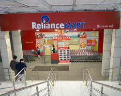Entrance of the Reliance Mart on Gandhinagar-Sarkhej Highway road in Ahmedabad on January 18, 2013. India's largest private firm Reliance Industries reported on Friday a surprise 24 percent rise in quarterly net profit as higher refining margins offset slowing output from offshore fields. AFP PHOTO