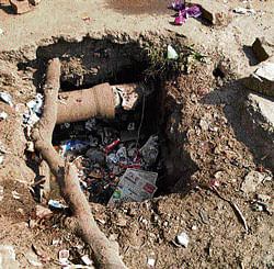 Poor planning A water line in an open drain at Srinivagilu Tank Bed Layout. DH photo