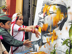 THE PATRIOT: Children pay tribute to Subhas Chandra Bose on his 116th birth anniversary in Gurgaon onWednesday. PTI