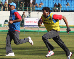India's M S Dhoni and Rohit Sharmaduring a practice session in Dharamshala on Friday. PTI