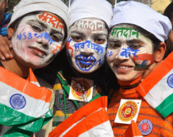 Students jubilate with Tricolours on the eve of Republic Day. PTI