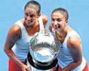 Crack pair: Italys Sara Errani (right) and Roberta Vinci pose with the Australian Open doubles trophy on Friday. reuters