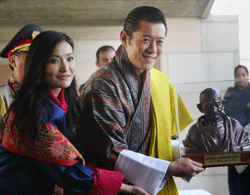 King of Bhutan, Jigme Khesar Namgyel Wangchuck and Queen Jetsun Pema receive a memento at the Rajghat in New Delhi on Friday. PTI