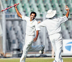 impact player: Mumbai pacer Dhawal Kulkarni (left) celebrates after his teams win. pti