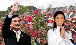 different roles: Prime Minister MsYingluck cuts ribbons and makes speeches while her brother Thaksin runs the country from exile.