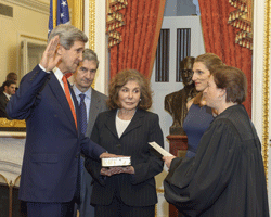 Former Senator and chairman of the Senate Foreign Relations Committee John Kerry (D-MA) is officially sworn-in as Secretary of State as his wife, Teresa Heinz Kerry (C) looks on in this handout photo release by the U.S. Senate Photographic Studio in Washington D.C. February 1, 2013. REUTERS