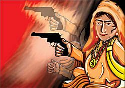 Gun-toting woman monk cynosure at Kumbh