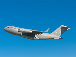 gargantuan: A  C-17 plane in mid-air.  Photo credit: Boeing