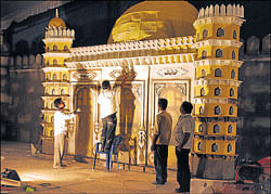 Workers give final touches to the dais of the Sammelan, modelled after the Gol Gumbaz, on  Friday. dh photo, kpn