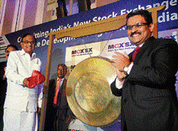 Finance Minister P Chidambaram (left) and MCX-SX  Vice-Chairman Jignesh Shah at the launch of the new  stock exchange in Mumbai on Saturday. PTI Photo