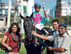 One for the album: Owners Mrs MM&#8200;Annaiah (left), N Ramesh (extreme right) and trainer Tharun Thimmaiah (second from right) lead in Drop Of Honey (S John astride) after the victory in the Stayers Trial Stakes at the Bangalore Turf Club on Saturday. DH&#8200;PHOTO
