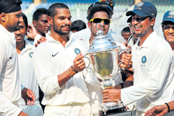 Delightful moment: Rest of India players celebrate their triumph in the Irani Cup on Sunday. pti