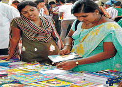 Visitors browse through books at the stalls put up at the Kannada Sahitya Sammelana in Bijapur on Monday. KPN