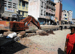 Two years on, razed shops push traders to brink