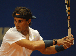 Spanish tennis player Rafael Nadal returns the ball during the doubles match with Argentinian David Nalbandian against Spanish Pablo Andujar and Guillermo Garcia-Lopez, at the Brazil Open in Sao Paulo, Brazil, on February 12, 2012. AFP PHOTO