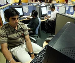Employees at a call centre provide service support to international customers in Bangalore March 17, 2004.  Credit: Reuters