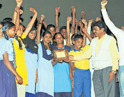 Cheering on: N R Nanjunde Gowda felicitating the students.