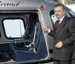 Finmeccanica Chairman and Chief Executive Officer Giuseppe Orsi poses next to a helicopter during the opening ceremony of the new Terminal of Vertiporto dell'Urbe in Rome January 19, 2009. The new head of Italian defence group Finmeccanica has inherited a corruption crisis over a $750 million (483.7 million pounds) helicopter deal with India that risks hurting the company's business in other foreign markets. Italy's second largest corporate employer moved chief operating officer Alessandro Pansa into the top job after police arrested CEO and Chairman Giuseppe Orsi on February 12, 2013. Picture taken January 19, 2009. REUTERS