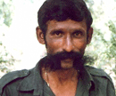 This undated file photo shows India's most wanted man, Koose Muniswamy Veerappan, who was shot dead by police in October 2004. Four bandits - associates of notorious smuggler Veerappan - sentenced to death over a landmine blast that killed 22 policemen in 1993 approached India's Supreme Court February 16, 2013 seeking a stay on their execution, a lawyer for the men said. AFP