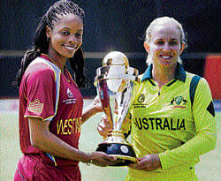 The cup that matters: West Indies skipper Merissa Aguilleira (left) and her Australian counterpart Jodie Fields pose with the World Cup in Mumbai on Saturday. pti