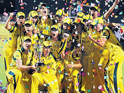 The Australian cricket team poses with their Champions trophy after winning the ICC Womens World Cup 2013 beating West Indies at the Brabourne Stadium in Mumbai on Sunday. Australia won the match by 114 runs. AFP