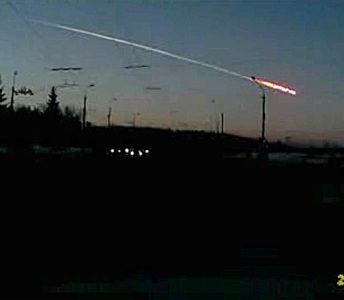 In this frame grab made from dashboard camera video, a meteor streaks through the sky over Chelyabinsk, about 1500 kilometers (930 miles) east of Moscow, Friday, Feb. 15, 2013. With a blinding flash and a booming shock wave, the meteor blazed across the western Siberian sky Friday and exploded with the force of 20 atomic bombs, injuring more than 1,000 people as it blasted out windows and spread panic in a city of 1 million. (AP Photo