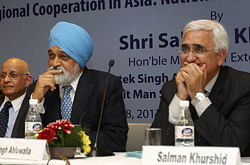 External Affairs Minister, Salman Khurshid , Deputy Chairman of Planning Commission, Montek Singh Ahluwalia and Former Indian Foreign Secretary, Lalit Mansingh during the Abid Hussain Memorial Lecture organized by India China Economic and Cultural Council, in New Delhi on Monday. PTI Photo