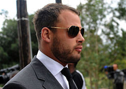 South African Springbok rugby player Francois Hougaard attends the late South African model Reeva Steenkamp's funeral ceremony at the crematorium building in Port Elizabeth on February 19, 2013 after Steenkamp, 29, was shot four times in the early hours of February 14, 2013 by a 9mm pistol owned by South African sporting hero Oscar Pistorius. South African prosecutors on Tuesday told a bail hearing that Oscar Pistorius was guilty of 'premeditated murder' in the Valentine's Day killing of his model girlfriend at his upscale home. AFP PHOTO