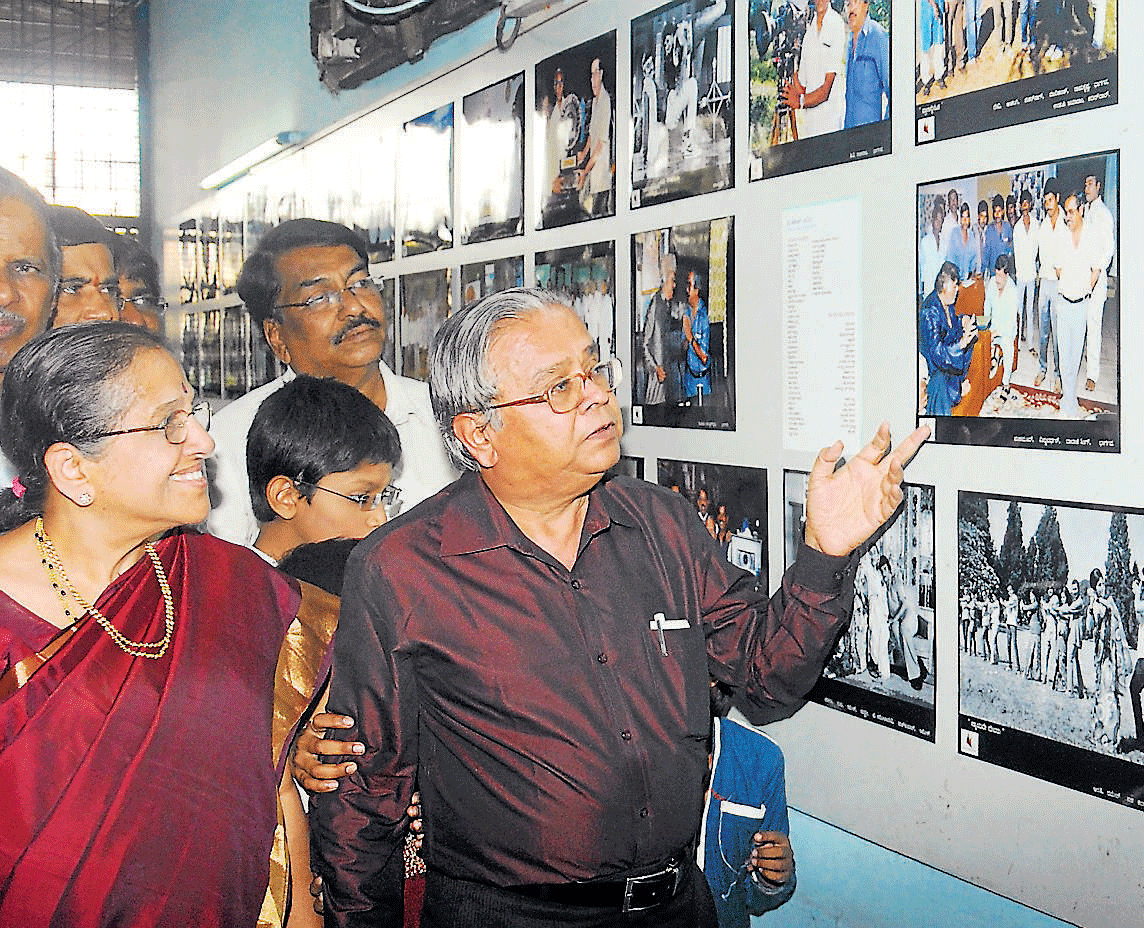 Nostalgic Bhargava scanning through his photographs.