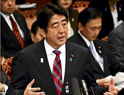Being cautious: Japanese Prime Minister Shinzo Abe speaks during Monday's session of Upper House Budget Committee in Tokyo. AP