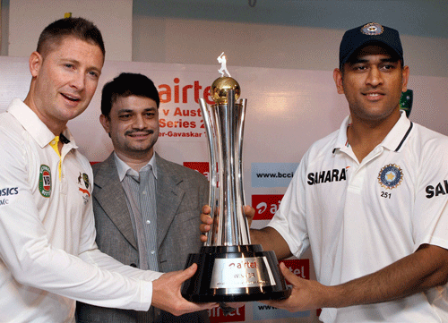 Indian Cricket Team Skipper M.S. Dhoni and Australian Cricket team Skipper Michael Clarke unveil the Border-Gavaskar 2013 test series trophy at MA Chidambaram Stadium in Chennai. PTI Photo