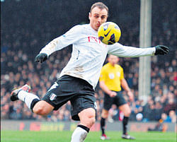 Super strike: Fulhams Dimitar Berbatov is poised to score against Stoke City in the English Premier League on Saturday.  Fulham won 1-0. AFP