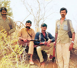 Slain sandalwood smuggler and poacher Veerappan, who carried the highest bounty of Rs 40 lakh during his hey days two decades ago, with his men in their forest den. The bandit eluded the police taking advantage of the contiguous forests of Kollegal in Karnataka and Sathyamangalam in Tamil Nadu, spread across 6,000 sq km.