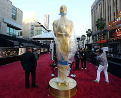 A statue in the likeness of an Oscar award is displayed on the red carpet for the 85th Academy Awards in Los Angeles. AP Photo