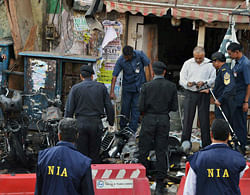 Investigating agencies collecting samples a day after the twin blast occurred at Dilsukhnagar in Hyderabad. PTI Image