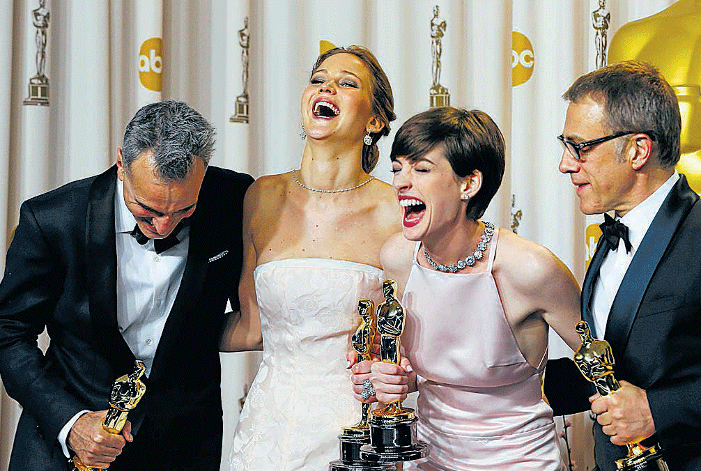 All smiles: Daniel Day-Lewis, Jennifer Lawrence, Anne Hathaway and Christoph Waltz.