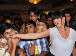 Mumbai: Pakistani Actress Veena Malik with fans during her birthday celebration in Mumbai on Tuesday. Malik made an attempt to enter the guinness record by getting 100 kisses by fans in one minute. PTI Photo
