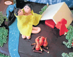 A couple under a sheet in mountains cake designed by Divya Sreeji.