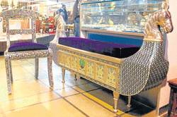 A whitemetal couch with meenakari work