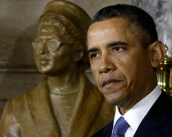 President Barack Obama speaks at the unveiling of a statue of Rosa Parks, left, Wednesday, Feb. 27, 2013, on Capitol Hill in Washington. (AP Photo)