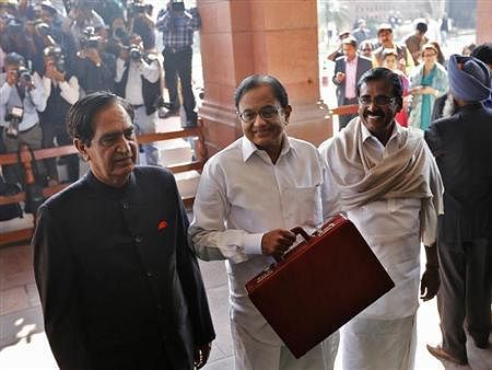 Budget 2013 Finance Minister Palaniappan Chidambaram (C) arrives at the parliament. Reuters