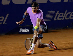 Rafael Nadal of Spain hits a return to Diego Sebastian Schwartzman of Argentina during their men's singles match at the Mexican Open tennis tournament in Acapulco February 26, 2013. REUTERS